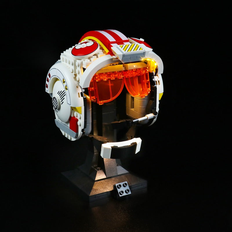 Lit helmet building block model photographed in low light