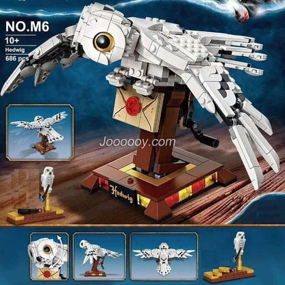 Assembled snowy owl building block figure on perch
