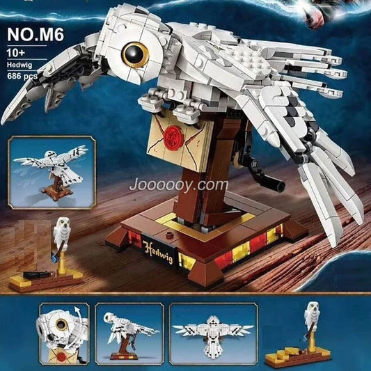 Assembled snowy owl building block figure on perch