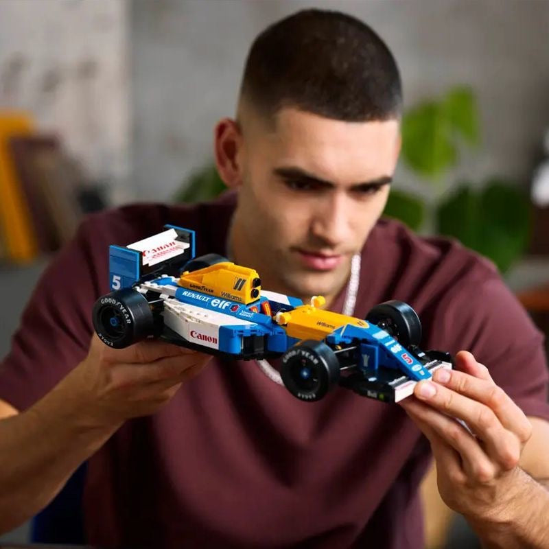 Close-up of the driver figure seated in the racing car cockpit