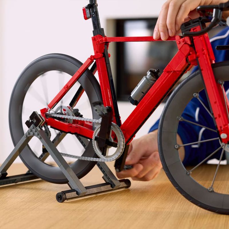 Close-up of spoked wheel and gear detail on the bike model