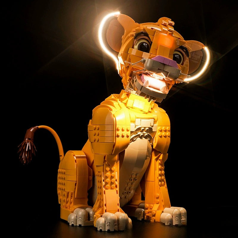 Lit view of the assembled lion cub display