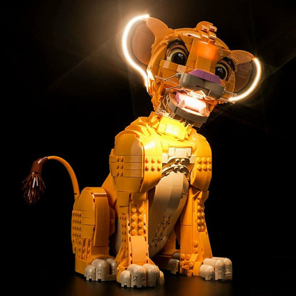 Lit view of the assembled lion cub display